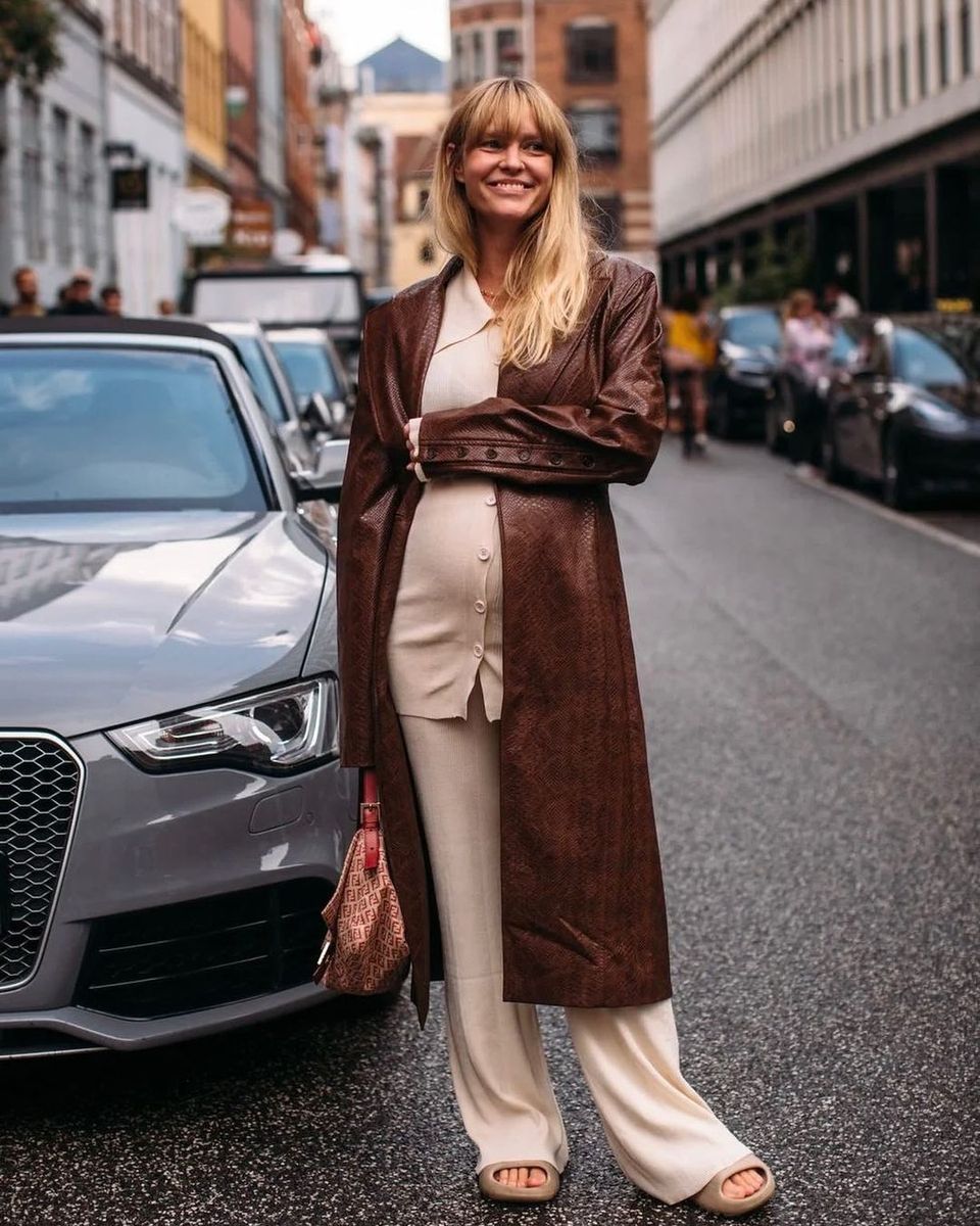 Madsen wear a soft set, brown leather coat and slides